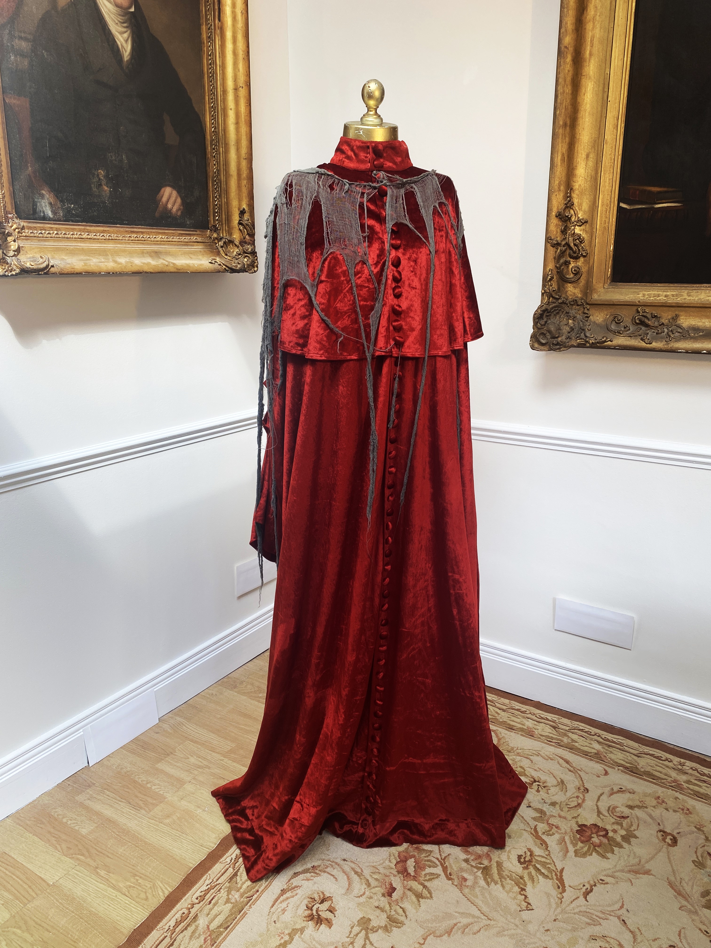 A Cardinal’s robe in red velvet with cobweb decorations (marked Royal Opera House – Faust 1992)